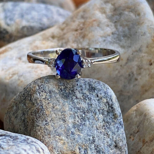 14 kt white gold ring set with royal blue sapphire and diamonds